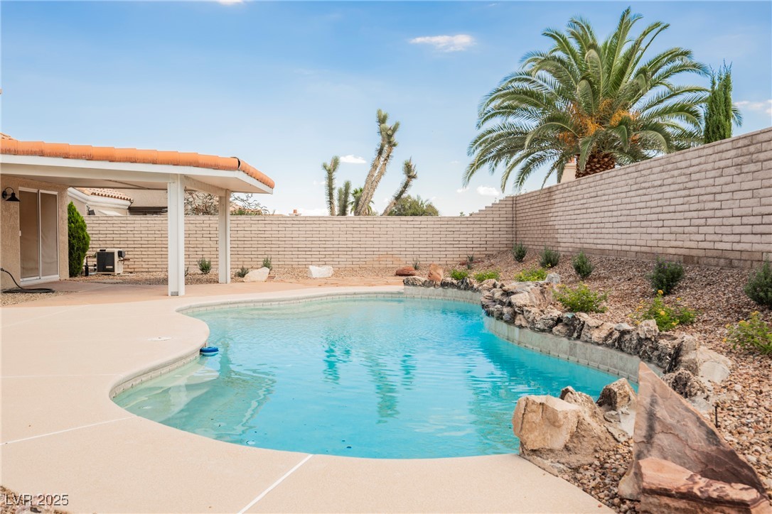 9337 Quail Ridge Drive Las Vegas, NV 89134 - Photo 28 of 28 View of swimming pool with a fenced backyard and a patio area