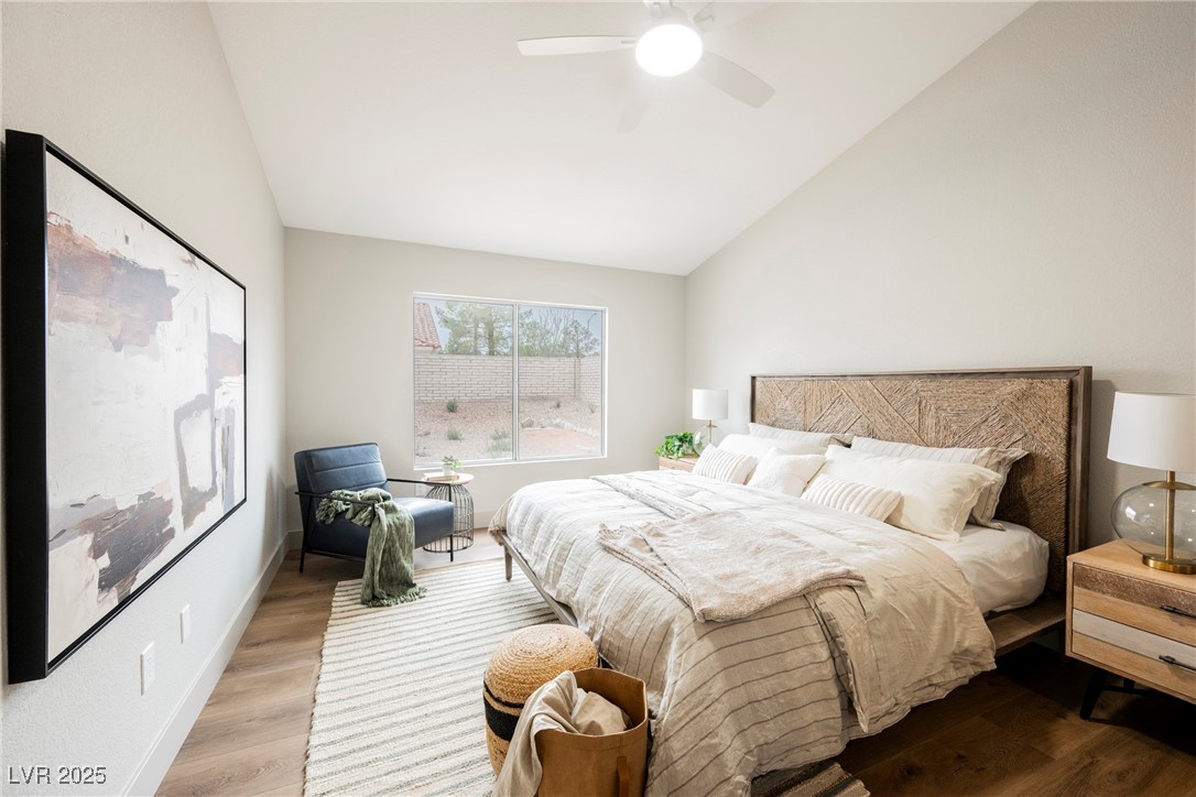 9337 Quail Ridge Drive Las Vegas, NV 89134 - Photo 10 of 28 Bedroom with lofted ceiling, wood finished floors, and a ceiling fan
