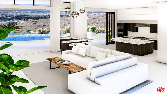 32 Granite Ridge Road Rancho Mirage, CA 92270 - Photo 6 of 11 a living room with furniture and a painting on the wall