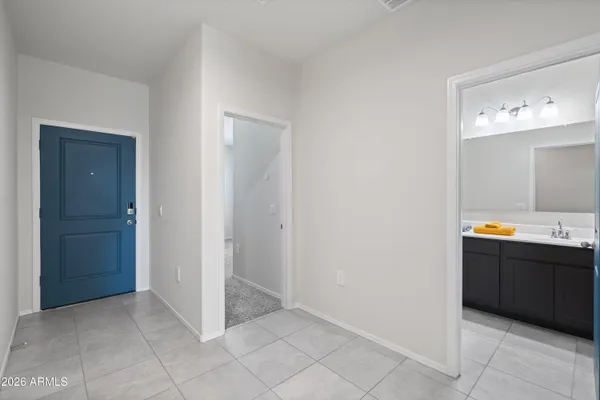 a view of kitchen with granite countertop cabinets and sink