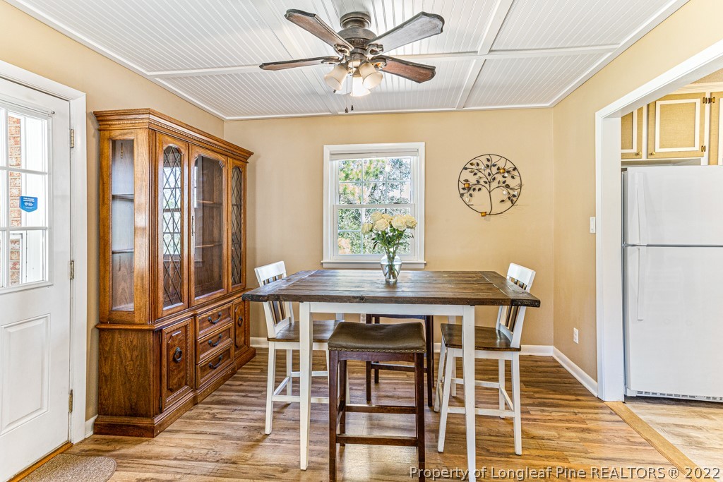 1435 Marlborough Road Fayetteville, NC 28304 - Photo 11 of 35 a view of a dining room with furniture window and wooden floor