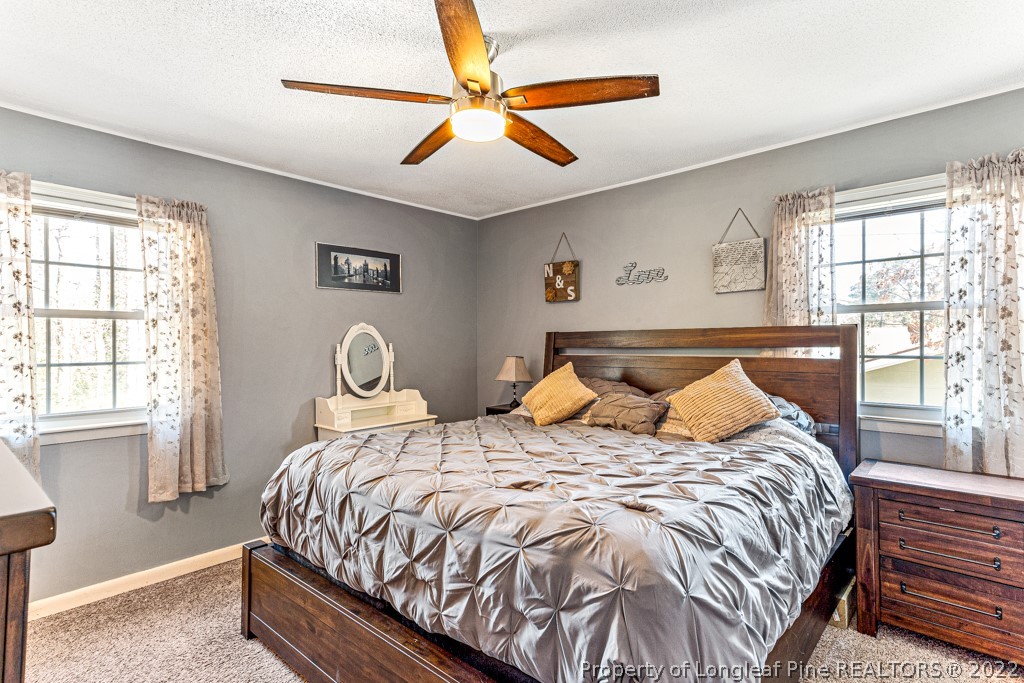 1435 Marlborough Road Fayetteville, NC 28304 - Photo 23 of 35 a bedroom with a bed and window