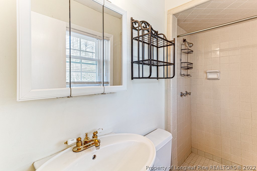 1435 Marlborough Road Fayetteville, NC 28304 - Photo 25 of 35 a bathroom with a bathtub and shower