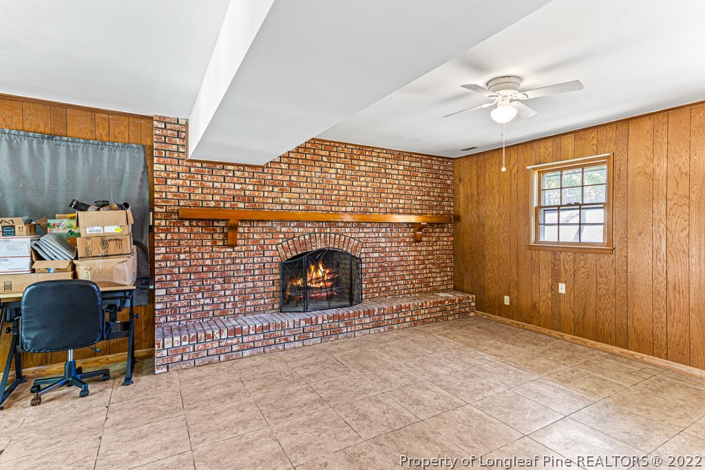 1435 Marlborough Road Fayetteville, NC 28304 - Photo 27 of 35 a view of livingroom with fireplace and fan