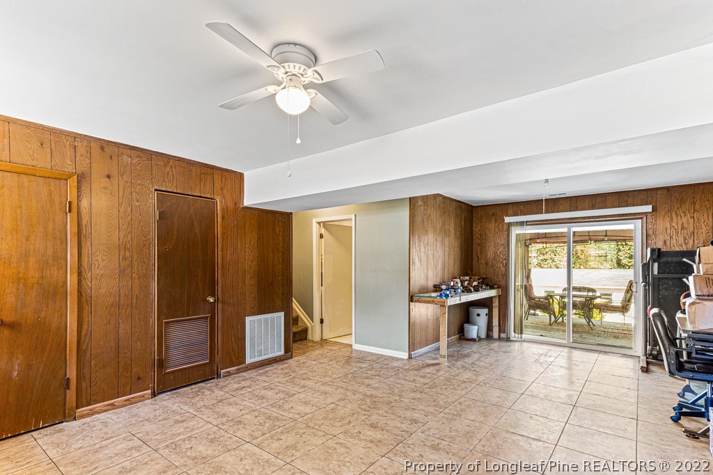 1435 Marlborough Road Fayetteville, NC 28304 - Photo 28 of 35 a view of a livingroom with a dinning area hardwood floor and a ceiling fan