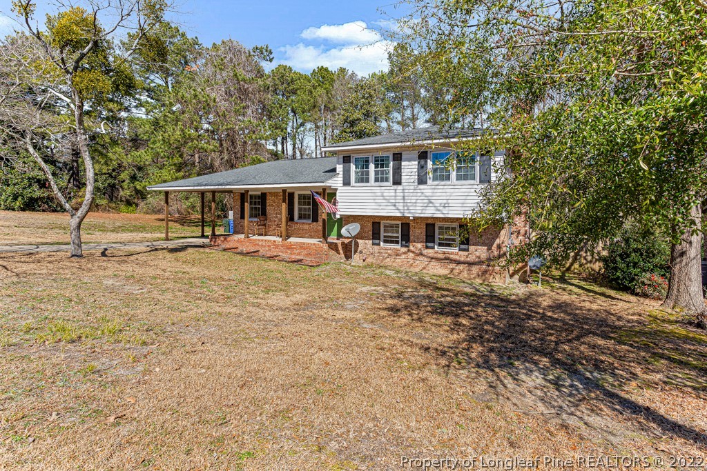 1435 Marlborough Road Fayetteville, NC 28304 - Photo 3 of 35 a view of a house with a yard