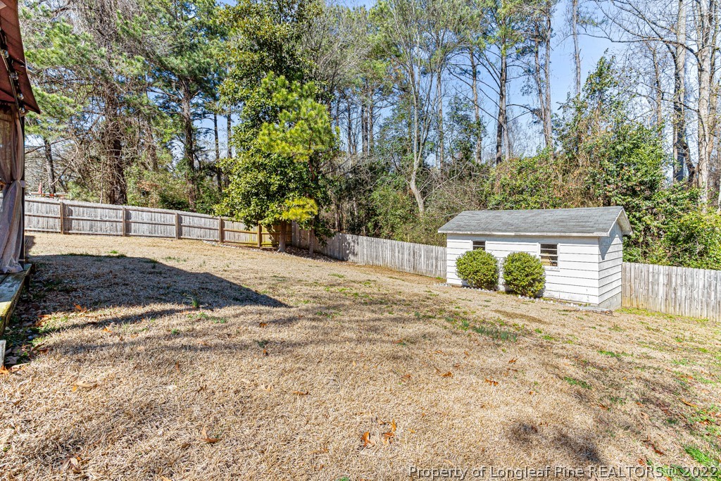 1435 Marlborough Road Fayetteville, NC 28304 - Photo 31 of 35 a view of a house with a yard and tree