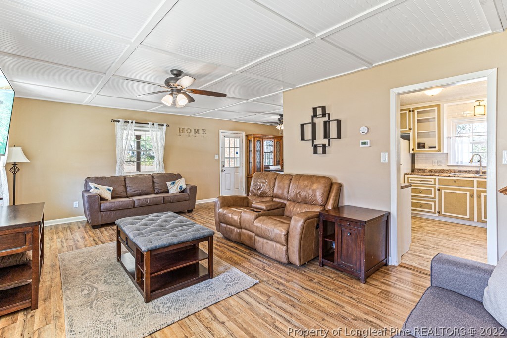 1435 Marlborough Road Fayetteville, NC 28304 - Photo 7 of 35 a living room with furniture and a chandelier