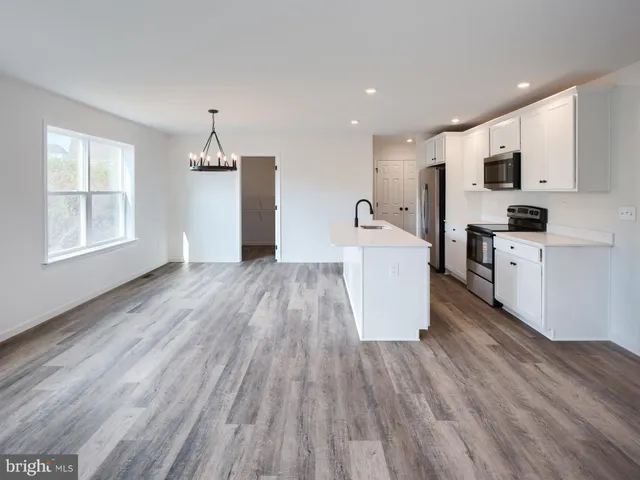 a view of a kitchen with microwave and stove