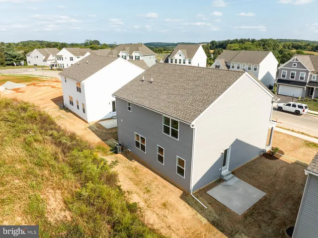 a view of a house with outdoor space and ocean view