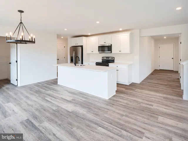 a view of kitchen with microwave and stove