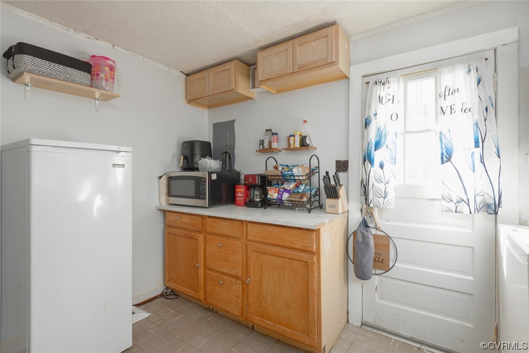 20 Old Enon Road Fredericksburg, VA 22406 - Photo 10 of 23 a kitchen with a refrigerator and cabinets