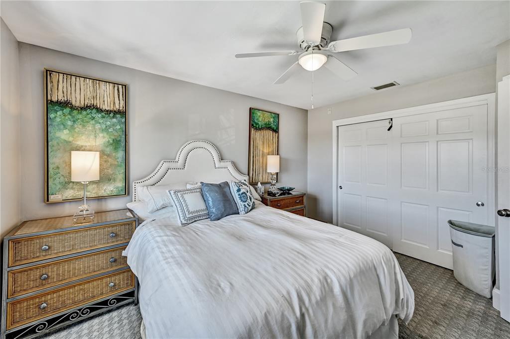 5854 Gasparilla Road, Unit M22 Boca Grande, FL 33921 - Photo 12 of 54 a bedroom with a bed and a window