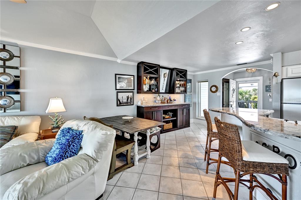 5854 Gasparilla Road, Unit M22 Boca Grande, FL 33921 - Photo 26 of 54 a living room with furniture and a flat screen tv