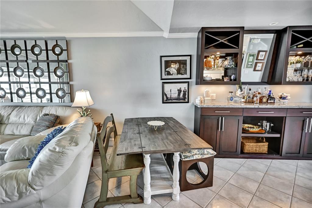 5854 Gasparilla Road, Unit M22 Boca Grande, FL 33921 - Photo 28 of 54 a living room with furniture and a table
