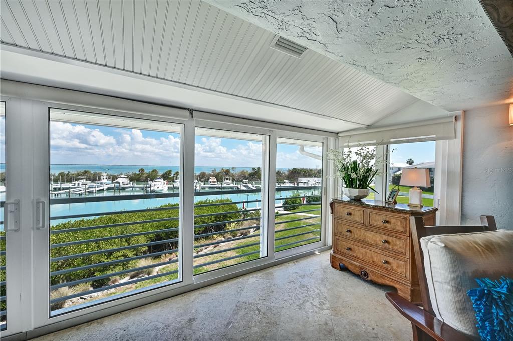5854 Gasparilla Road, Unit M22 Boca Grande, FL 33921 - Photo 31 of 54 a view of a bedroom with furniture and windows
