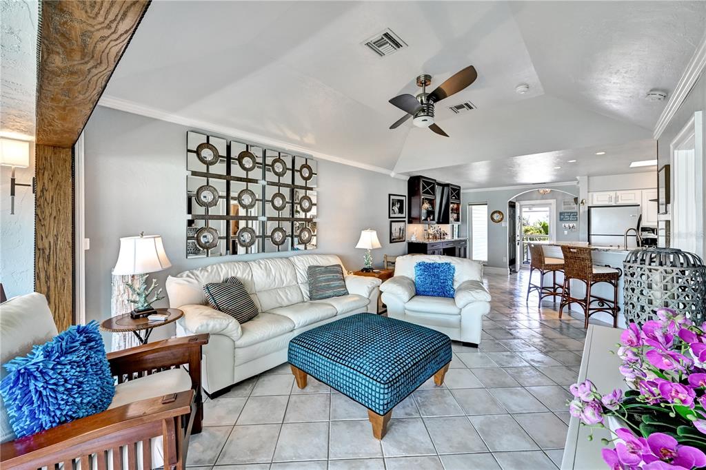5854 Gasparilla Road, Unit M22 Boca Grande, FL 33921 - Photo 32 of 54 a living room with furniture and a chandelier