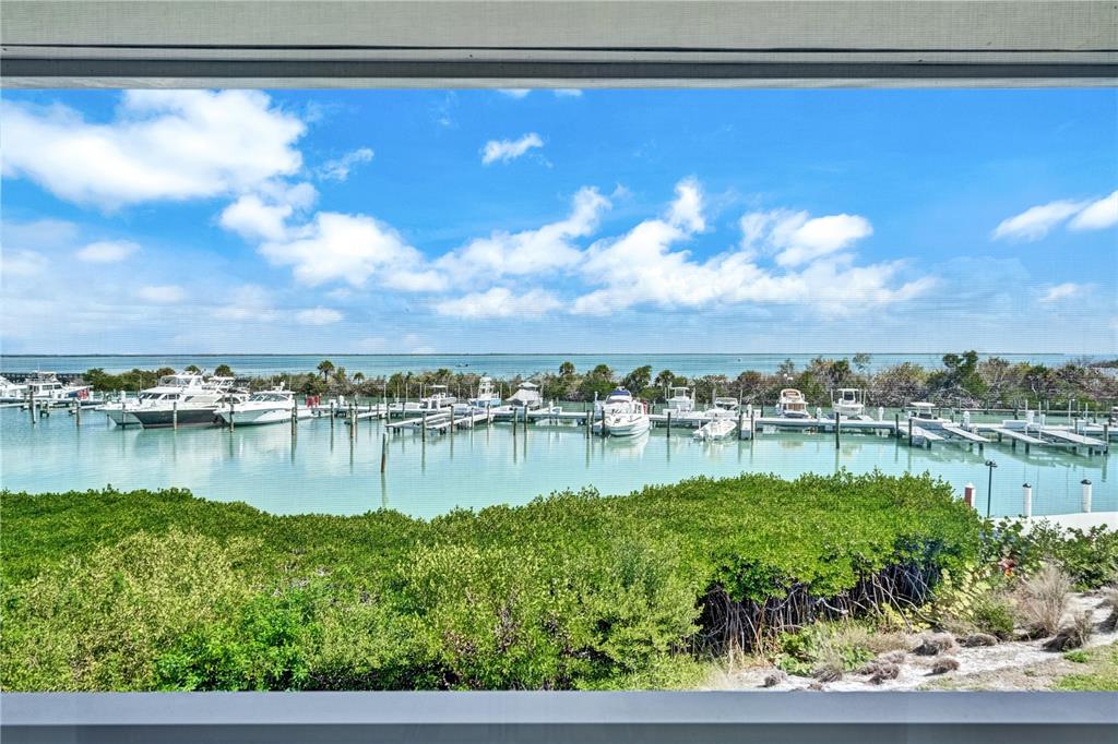 5854 Gasparilla Road, Unit M22 Boca Grande, FL 33921 - Photo 37 of 54 a view of a lake from a balcony