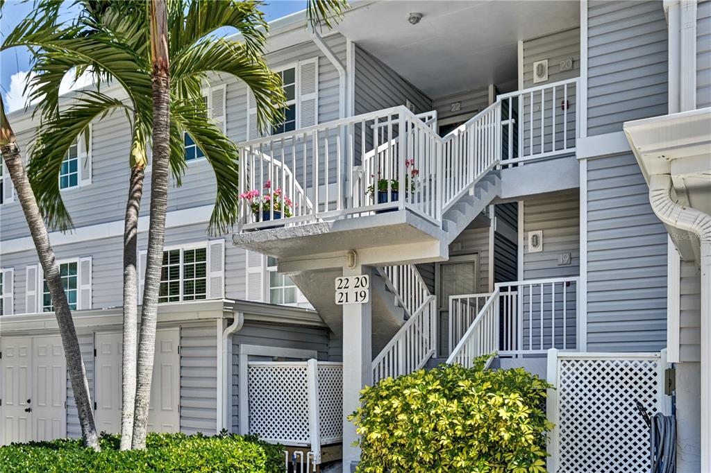 5854 Gasparilla Road, Unit M22 Boca Grande, FL 33921 - Photo 4 of 54 a front view of a house with a tree
