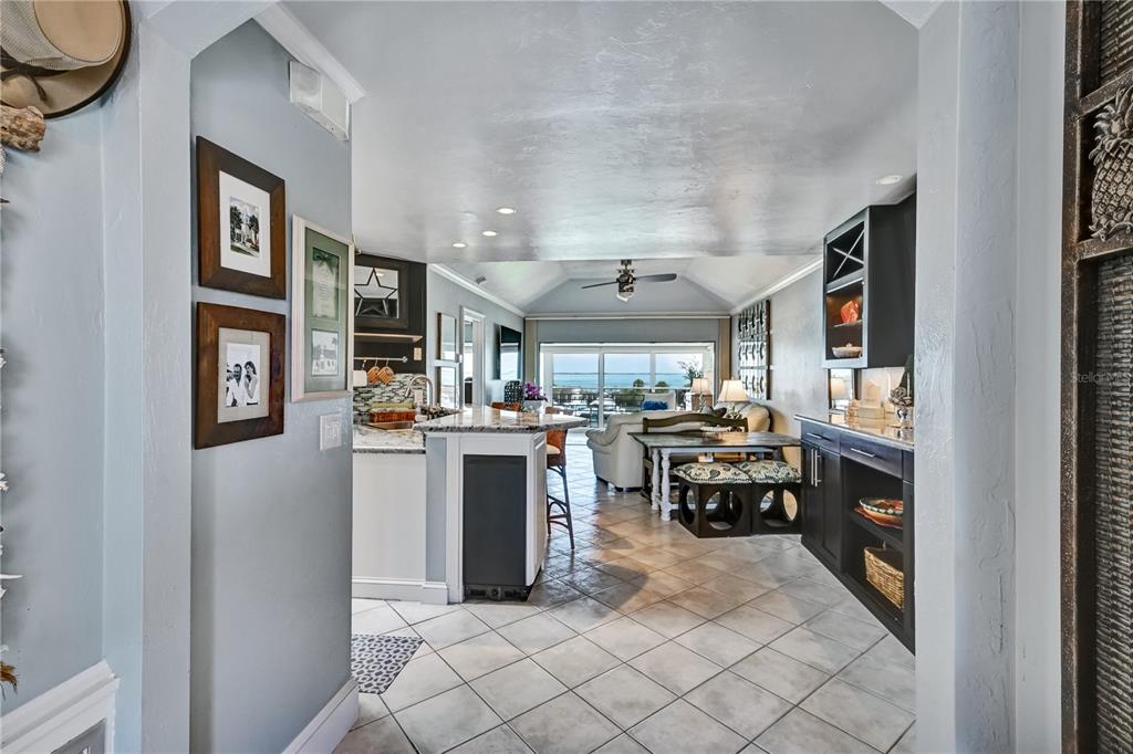 5854 Gasparilla Road, Unit M22 Boca Grande, FL 33921 - Photo 7 of 54 a kitchen with a sink and white cabinets