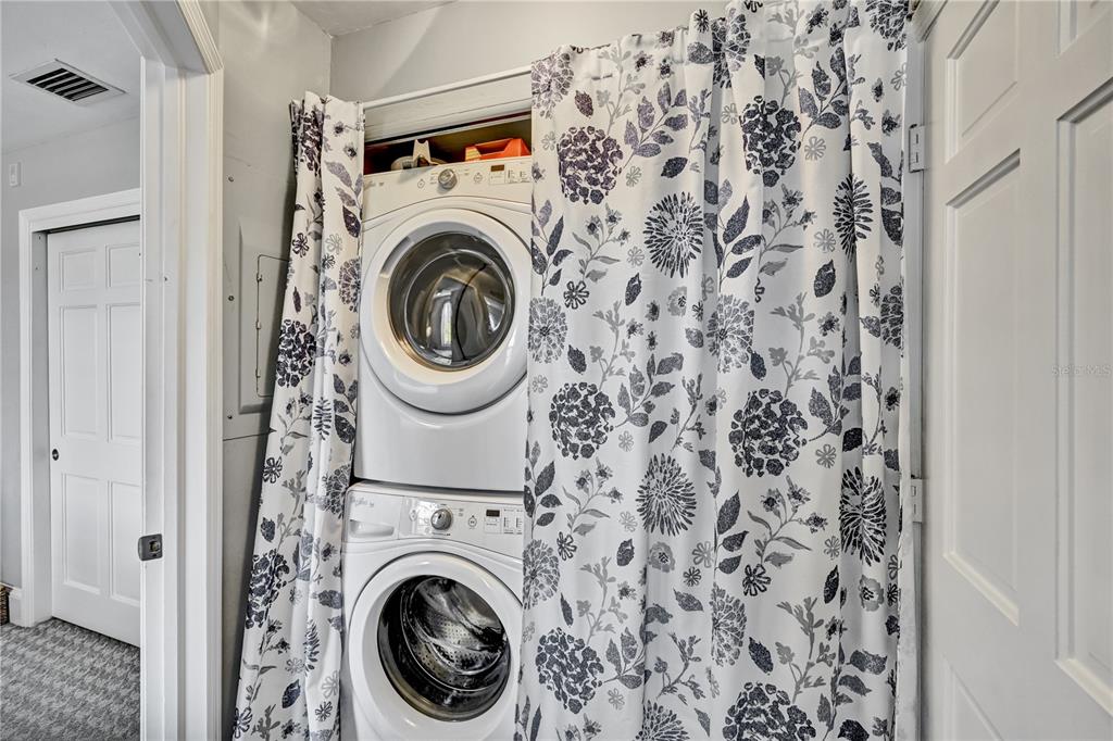 5854 Gasparilla Road, Unit M22 Boca Grande, FL 33921 - Photo 10 of 54 a utility room with dryer and washer