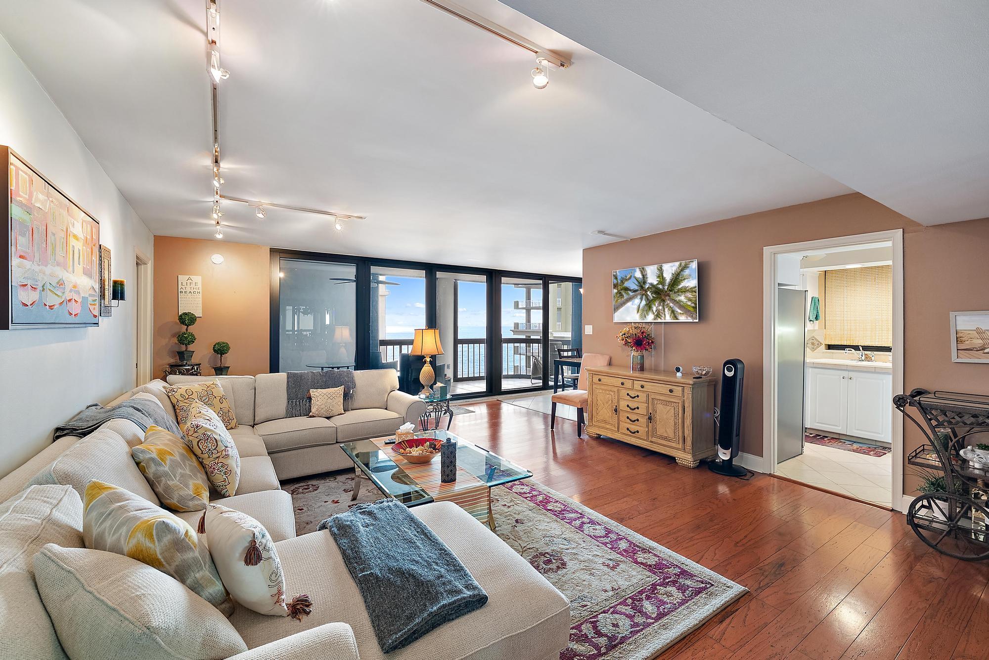 5380 North Ocean Drive, Unit 10B Singer Island, FL 33404 - Photo 2 of 50 a living room with furniture and wooden floor