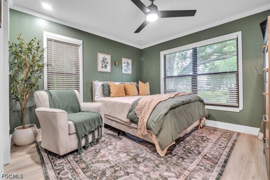 202 Ridgewood Avenue Clewiston, FL 33440 - Photo 31 of 50 a bedroom with a large bed and a window