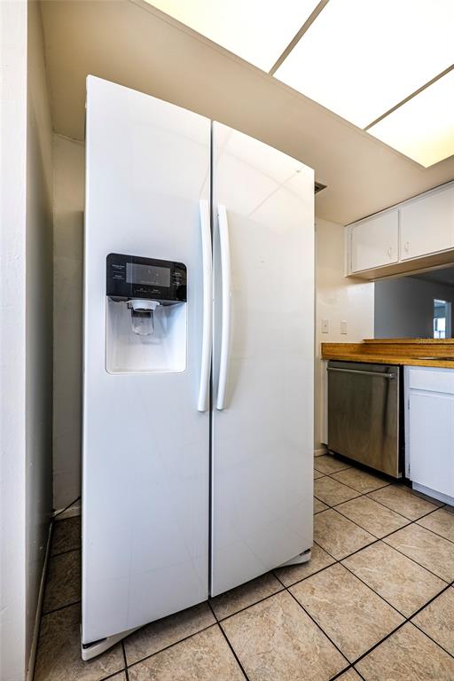 5197 Silent Loop, Unit 224 New Port Richey, FL 34652 - Photo 12 of 41 a kitchen with stainless steel appliances a refrigerator and a stove