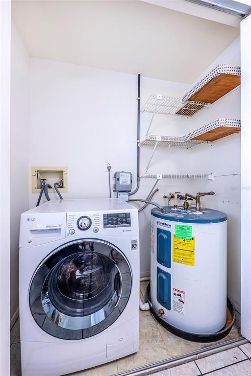 5197 Silent Loop, Unit 224 New Port Richey, FL 34652 - Photo 13 of 41 a utility room with dryer and washer