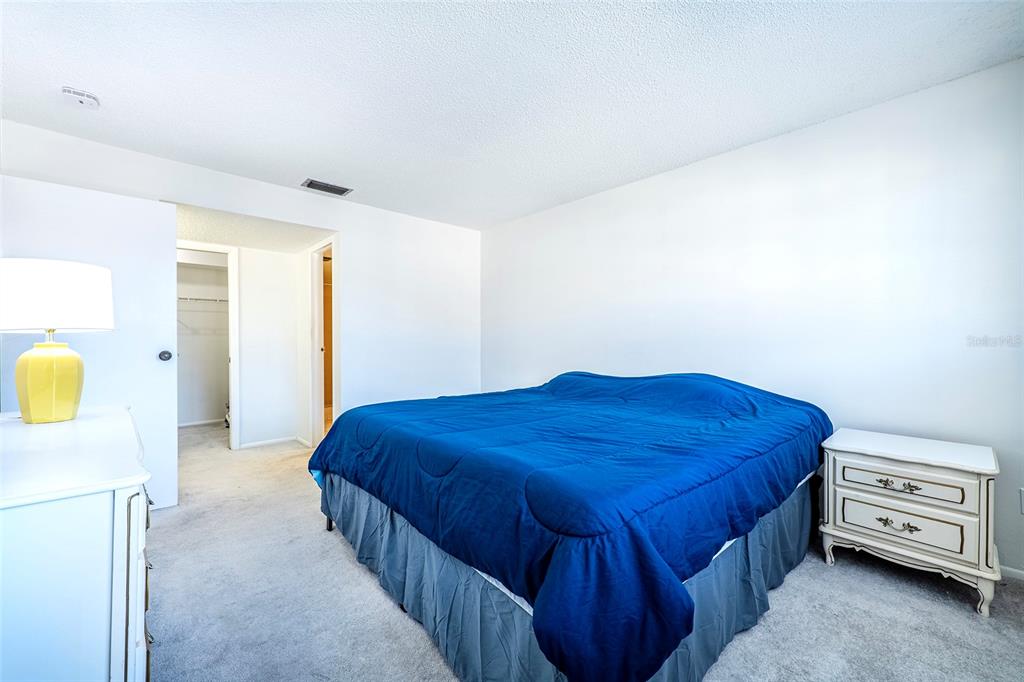 5197 Silent Loop, Unit 224 New Port Richey, FL 34652 - Photo 24 of 41 a bedroom with a bed and dresser