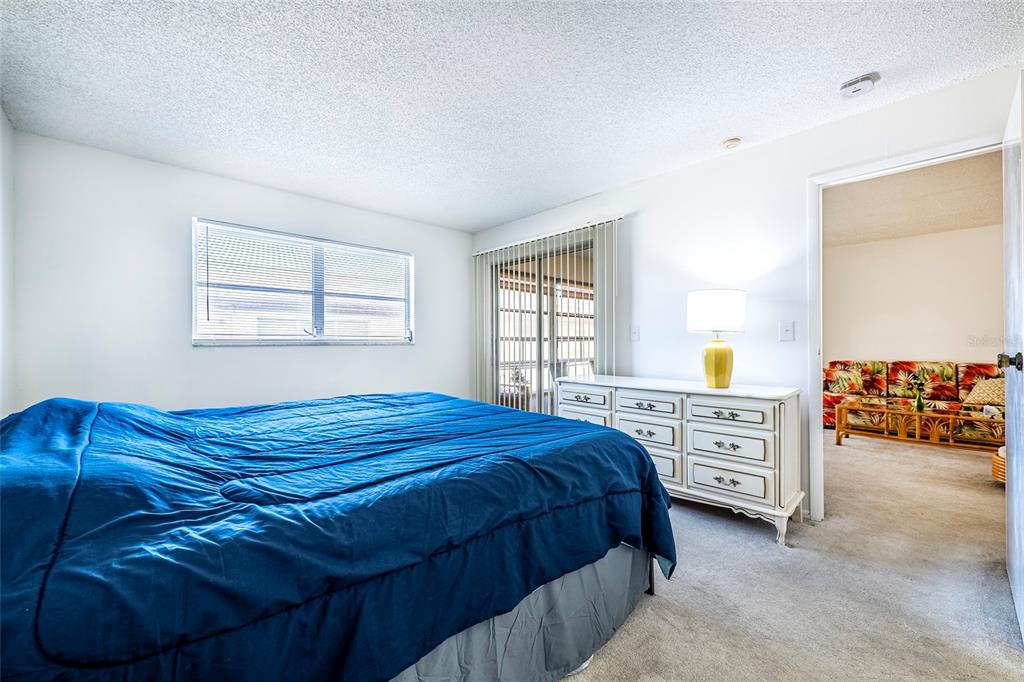 5197 Silent Loop, Unit 224 New Port Richey, FL 34652 - Photo 25 of 41 a bedroom with a bed and window