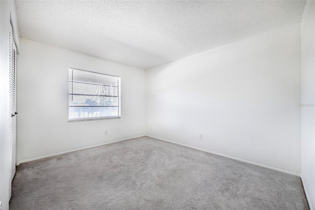 5197 Silent Loop, Unit 224 New Port Richey, FL 34652 - Photo 29 of 41 an empty room with a window