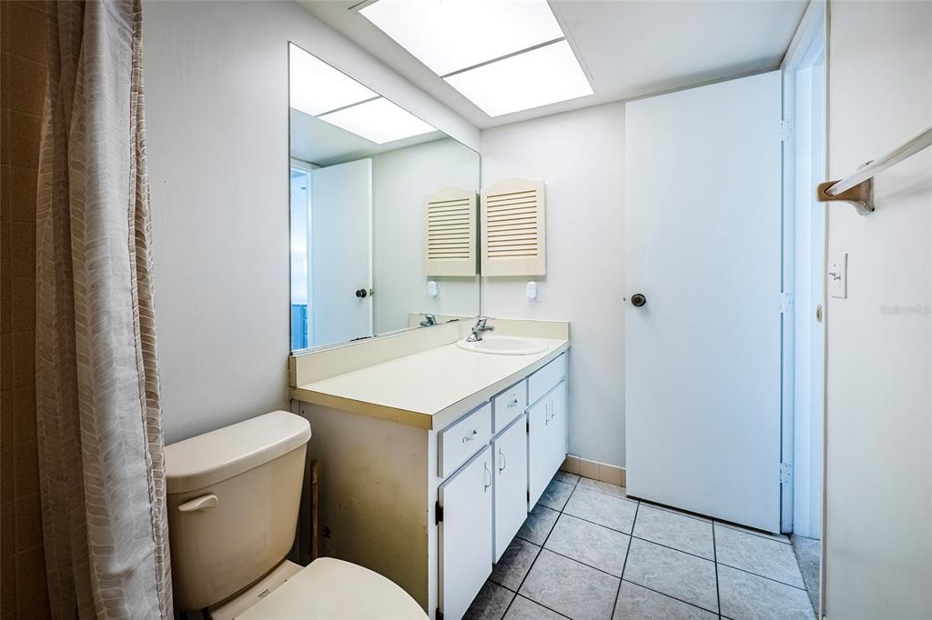 5197 Silent Loop, Unit 224 New Port Richey, FL 34652 - Photo 31 of 41 a spacious bathroom with a sink a toilet and a mirror