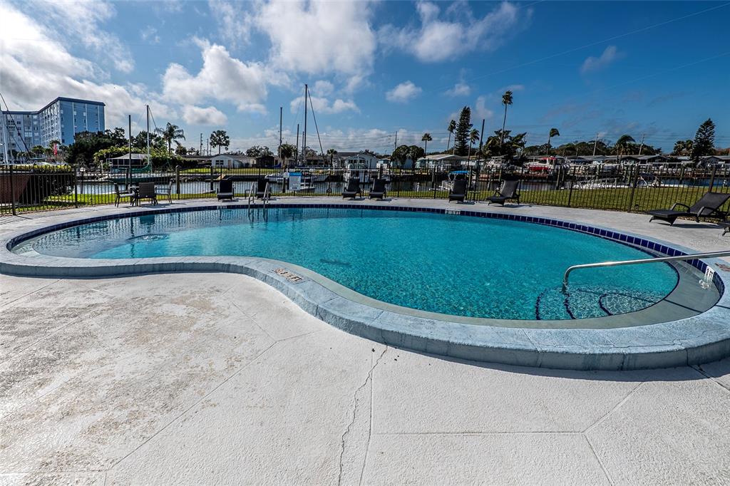 5197 Silent Loop, Unit 224 New Port Richey, FL 34652 - Photo 35 of 41 a view of a swimming pool with outdoor seating