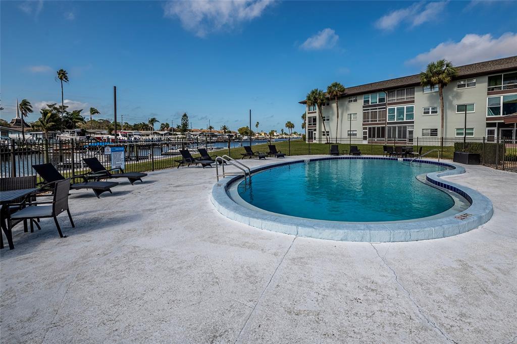 5197 Silent Loop, Unit 224 New Port Richey, FL 34652 - Photo 36 of 41 a view of a house with swimming pool and sitting area