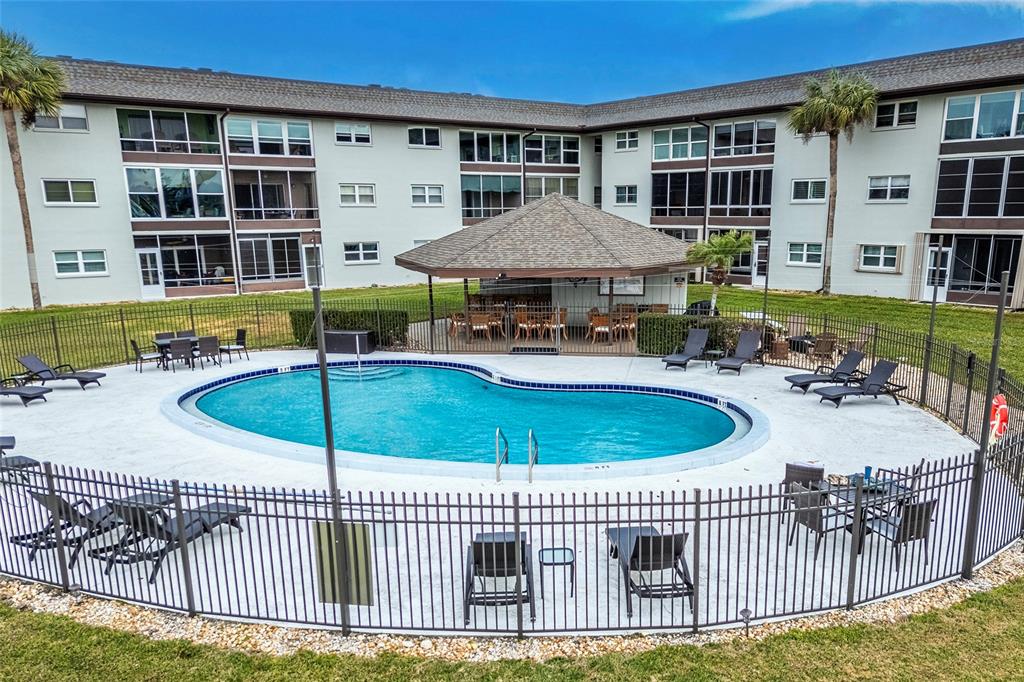 5197 Silent Loop, Unit 224 New Port Richey, FL 34652 - Photo 37 of 41 a view of a house with backyard and sitting area