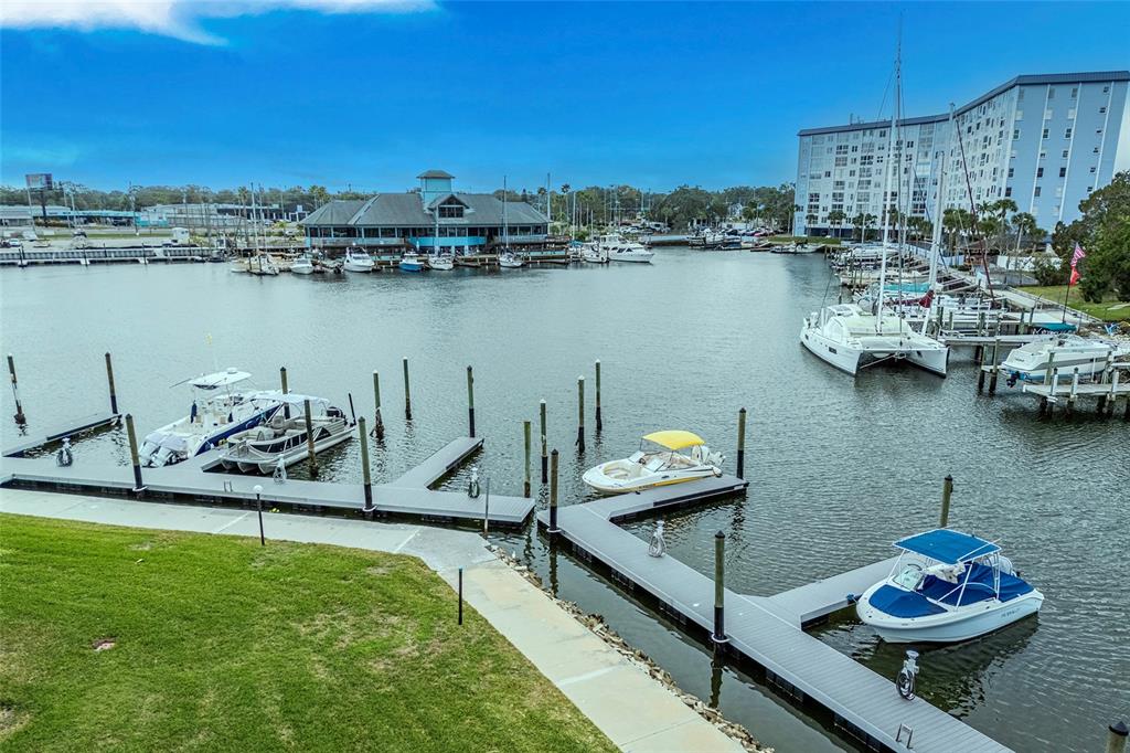 5197 Silent Loop, Unit 224 New Port Richey, FL 34652 - Photo 4 of 41 a view of a lake with a table and chairs
