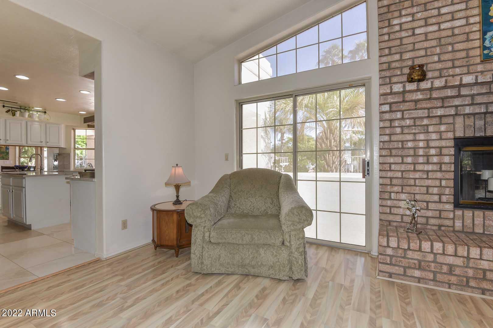 5237 North 106th Avenue Glendale, AZ 85307 - Photo 12 of 75 a living room with furniture and a flat screen tv