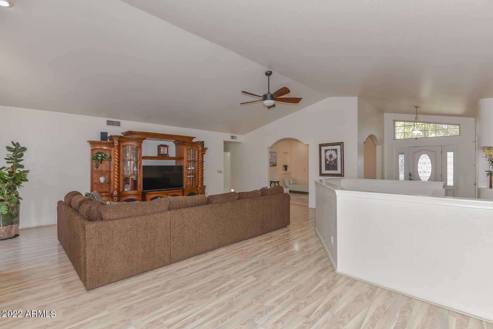 5237 North 106th Avenue Glendale, AZ 85307 - Photo 13 of 75 a living room with furniture and a flat screen tv