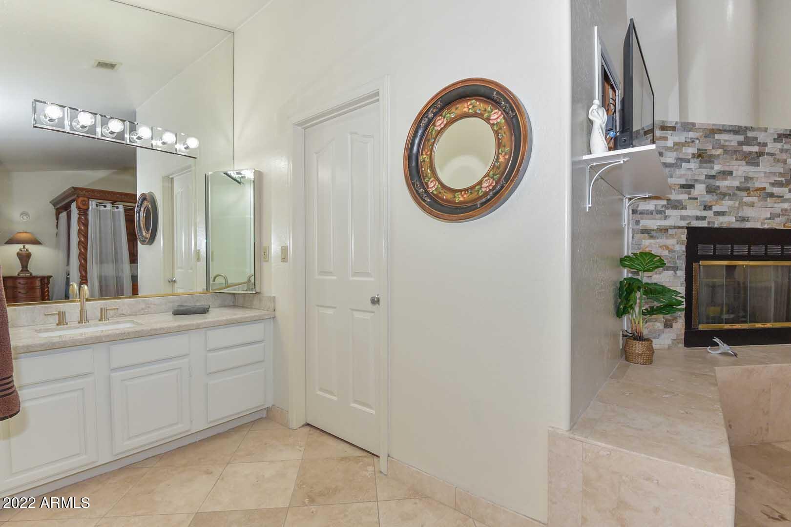 5237 North 106th Avenue Glendale, AZ 85307 - Photo 20 of 75 a spacious bathroom with a sink a mirror and a mirror
