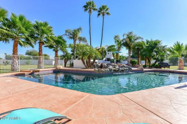 a view of a swimming pool with a patio