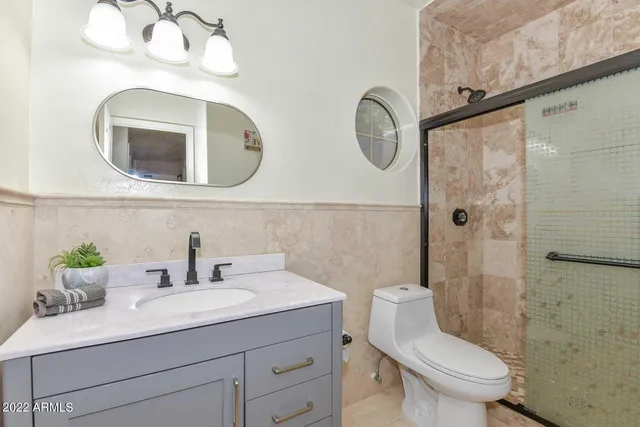 a view of a living room with furniture and wooden floor