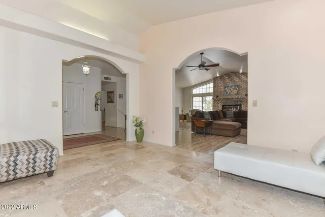 a bedroom with furniture and a window