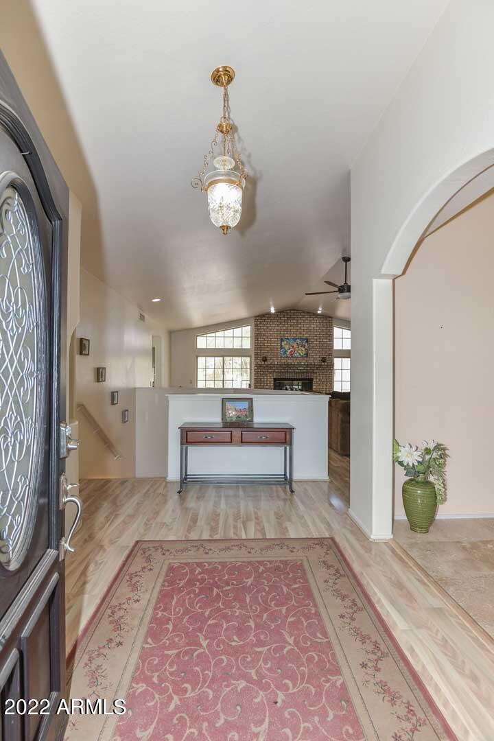 5237 North 106th Avenue Glendale, AZ 85307 - Photo 39 of 75 a living room with furniture and a rug