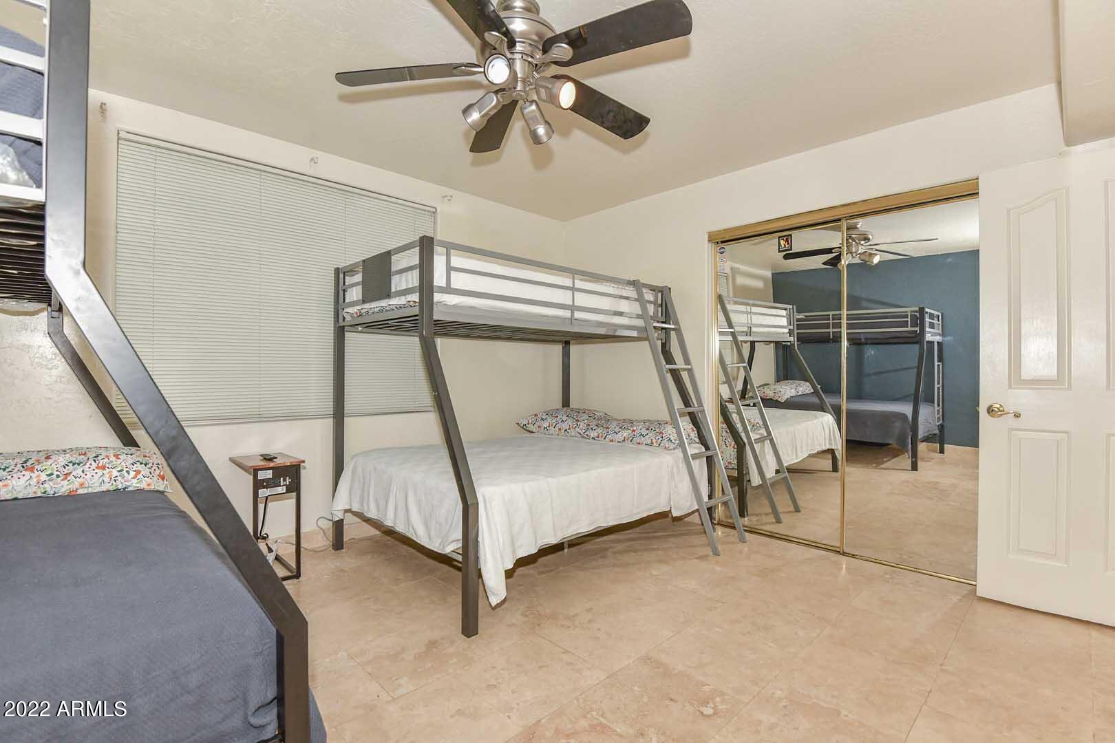 5237 North 106th Avenue Glendale, AZ 85307 - Photo 42 of 75 a bedroom with furniture and a window