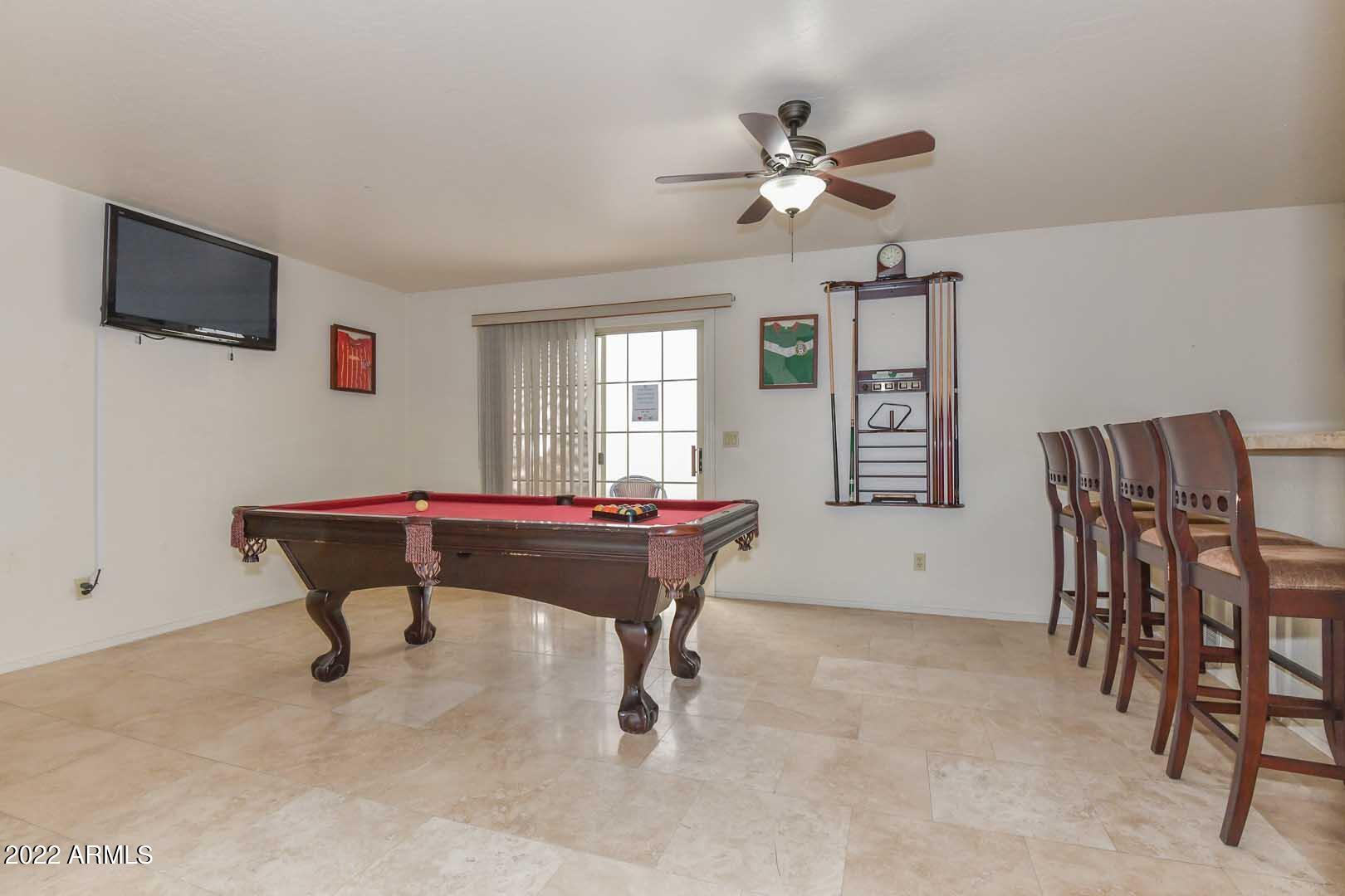 5237 North 106th Avenue Glendale, AZ 85307 - Photo 48 of 75 a room with furniture and a flat screen tv