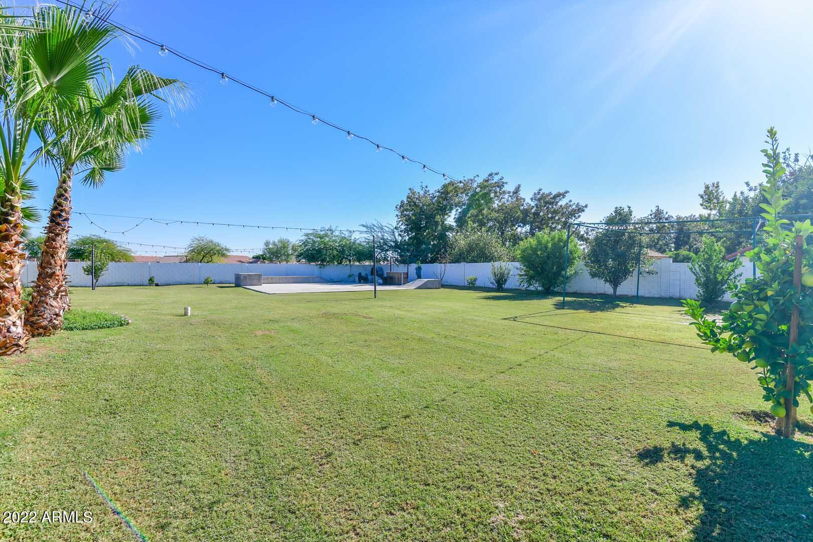 5237 North 106th Avenue Glendale, AZ 85307 - Photo 69 of 75 a view of yard with swimming pool and green space