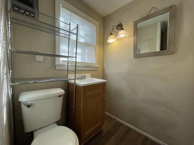 a bathroom with a toilet and a sink