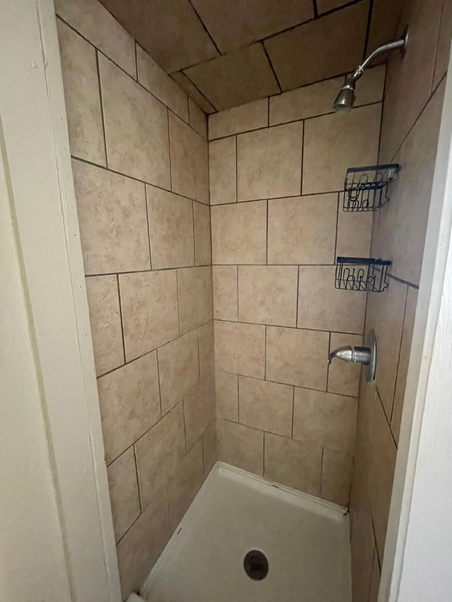 2520 27th Street, Unit REAR HOUSE Lubbock, TX 79410 - Photo 14 of 21 a bathroom with a shower and a bathtub
