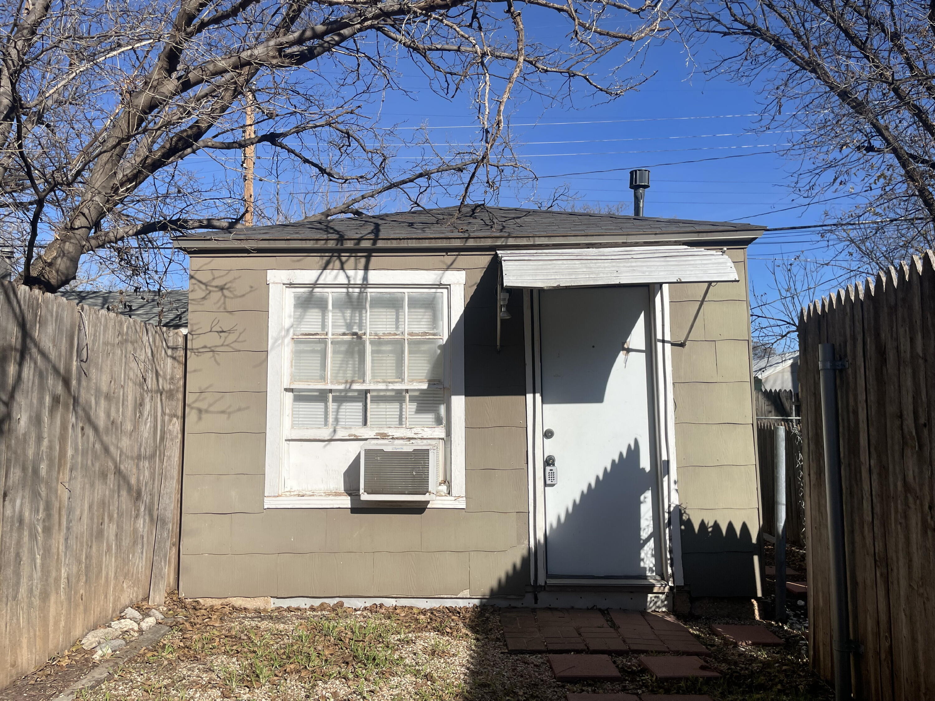 2520 27th Street, Unit REAR HOUSE Lubbock, TX 79410 - Photo 3 of 21 a view of a house with a door